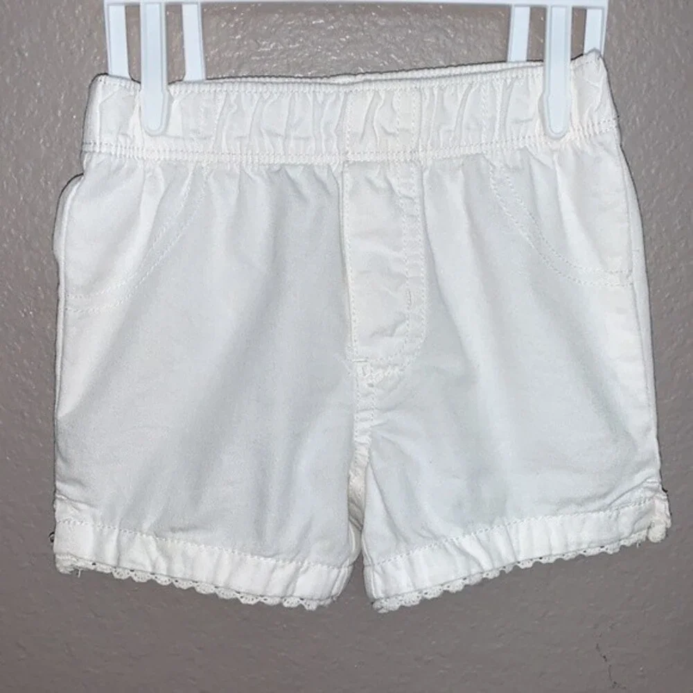 Carter's 12 month baby girl set of top and shorts.